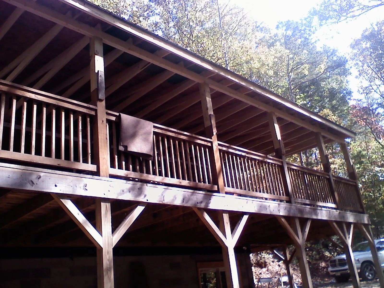 Timber framing under a new elevated porch and deck — Roof Leak Repair in Locust Valley by Roofing Brothers